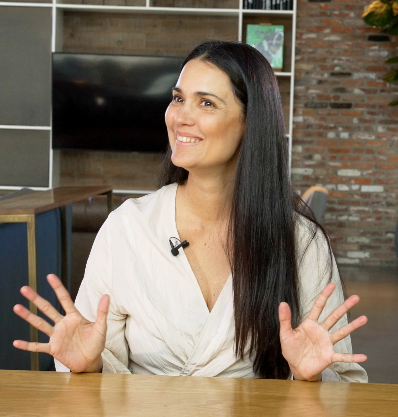 Juliana sharing a thought during an interview