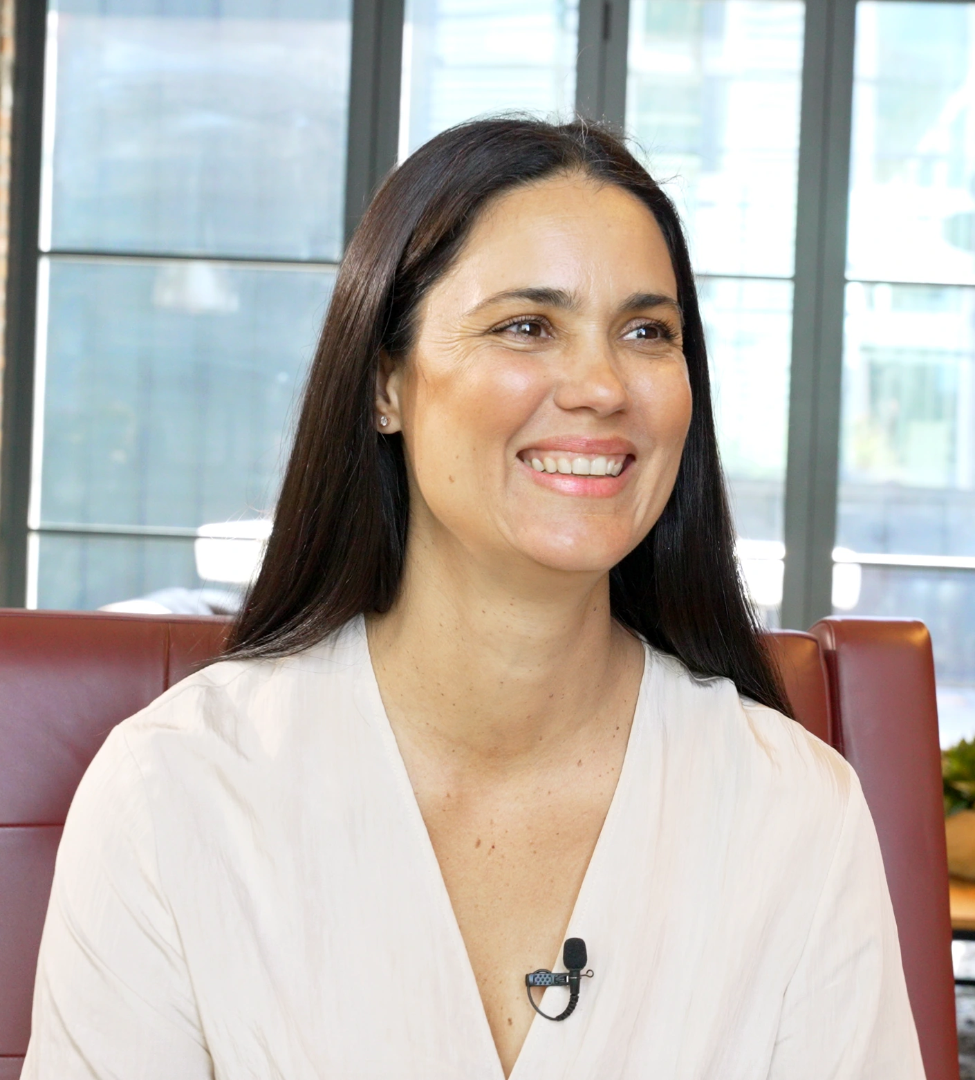 Juliana smiling during a conversation