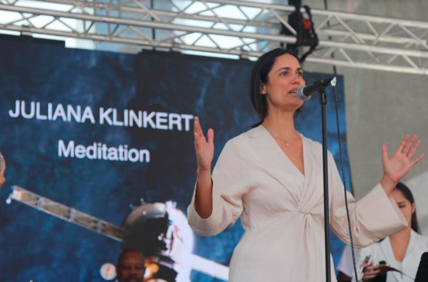 Juliana speaking on stage